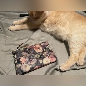 Pleather wristlet designed with flowers and lock from another era